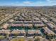 The high aerial view shows the well-organized community plan with water features and meticulously placed residences at 705 W Queen Creek Rd # 1201, Chandler, AZ 85248