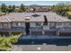 Aerial view of a multi-unit home featuring a tile roof, garages, and well-maintained landscaping at 705 W Queen Creek Rd # 1201, Chandler, AZ 85248