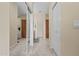 Hallway with carpet, white doors, and a mirrored closet at 705 W Queen Creek Rd # 1201, Chandler, AZ 85248
