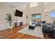 Inviting living room with modern entertainment center, cozy rug, and comfortable seating at 705 W Queen Creek Rd # 1201, Chandler, AZ 85248