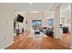 Spacious living room featuring wood floors, lots of light, and a comfortable sectional sofa at 705 W Queen Creek Rd # 1201, Chandler, AZ 85248