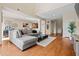 Open-concept living room with wood flooring, neutral paint, and comfortable sectional sofa at 705 W Queen Creek Rd # 1201, Chandler, AZ 85248