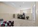 Cozy loft area with neutral carpeting, recessed lighting, and decorative shelving for storage and display at 705 W Queen Creek Rd # 1201, Chandler, AZ 85248