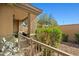 A covered patio with an outdoor ceiling fan and privacy provided by lush greenery around the side at 705 W Queen Creek Rd # 1201, Chandler, AZ 85248