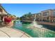 Condos overlooking a community water feature in Bridges at Ocotillo surrounded by trees and landscaping at 705 W Queen Creek Rd # 1201, Chandler, AZ 85248