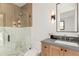 Modern bathroom featuring a glass shower, marble tile, and sleek vanity at 7498 E Whisper Rock Trl, Scottsdale, AZ 85266