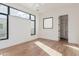 Bright, spacious bedroom with modern windows, hardwood floors, and walk-in closet at 7498 E Whisper Rock Trl, Scottsdale, AZ 85266