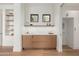 Stylish butler's pantry featuring custom cabinets, open shelves, and stone countertops at 7498 E Whisper Rock Trl, Scottsdale, AZ 85266