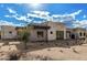 Beautiful exterior featuring stone accents, desert landscaping, and a modern architectural design at 7498 E Whisper Rock Trl, Scottsdale, AZ 85266