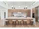 Modern kitchen featuring a large island with seating, sleek cabinetry, and high-end appliances, perfect for entertaining at 7498 E Whisper Rock Trl, Scottsdale, AZ 85266