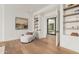 Bright office space features hardwood floors, built-in bookshelves, and contemporary design elements at 7498 E Whisper Rock Trl, Scottsdale, AZ 85266