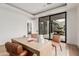Office featuring hardwood floors, large desk, and backyard view at 7498 E Whisper Rock Trl, Scottsdale, AZ 85266