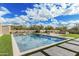 Backyard pool area with a sunning area, desert landscaping, and clear blue skies at 7498 E Whisper Rock Trl, Scottsdale, AZ 85266