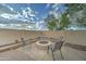 Cozy backyard with a brick paver patio and fire pit surrounded by comfortable seating at 7822 S 15Th Way, Phoenix, AZ 85042