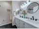 A bright bathroom with a double sink vanity and modern fixtures at 7822 S 15Th Way, Phoenix, AZ 85042