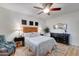 Cozy bedroom with ceiling fan, area rug, and a comfortable chair with soft throw at 7822 S 15Th Way, Phoenix, AZ 85042