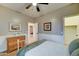 A bright bedroom with hardwood floors and a comfortable bed at 7822 S 15Th Way, Phoenix, AZ 85042