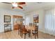 Bright dining room with wood table, hutch, six chairs, white curtains, and decorative painting at 7822 S 15Th Way, Phoenix, AZ 85042