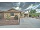 Charming single-story home featuring desert landscaping and a spacious driveway at 7822 S 15Th Way, Phoenix, AZ 85042