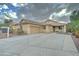 Inviting exterior with a two-car garage, well-maintained landscaping, and concrete driveway at 7822 S 15Th Way, Phoenix, AZ 85042