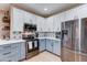 Modern kitchen features stainless steel appliances and stylish cabinets at 7822 S 15Th Way, Phoenix, AZ 85042