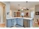 Kitchen featuring granite countertops, pendant lighting, and stainless steel appliances at 7822 S 15Th Way, Phoenix, AZ 85042