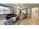 Open living room with cozy seating, lots of light, and wood flooring at 7822 S 15Th Way, Phoenix, AZ 85042