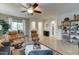 Bright living room featuring wood floors, dual recliners, and stylish decor at 7822 S 15Th Way, Phoenix, AZ 85042