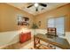 A well-lit office space with a large desk, storage cabinets, and a decorative rug at 7822 S 15Th Way, Phoenix, AZ 85042