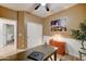 A traditional office space with a dark wood desk, white wainscoting, and closet at 7822 S 15Th Way, Phoenix, AZ 85042