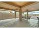Covered patio featuring a large dining table and ceiling fan, ideal for outdoor entertaining at 7822 S 15Th Way, Phoenix, AZ 85042