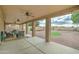 Wide covered patio area with comfortable lounge seating overlooking a gravel backyard at 7822 S 15Th Way, Phoenix, AZ 85042