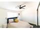 Bedroom with hardwood floors, mirrored closet doors, ceiling fan and a window at 7930 E Arlington Rd # 8, Scottsdale, AZ 85250