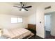 Bedroom features a ceiling fan, hardwood floors, and a neutral color scheme at 7930 E Arlington Rd # 8, Scottsdale, AZ 85250