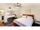 Bright bedroom includes soft lighting, a ceiling fan, and a mirrored closet at 7930 E Arlington Rd # 8, Scottsdale, AZ 85250