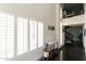 Bright foyer with high ceilings, hardwood flooring, and shuttered windows at 7930 E Arlington Rd # 8, Scottsdale, AZ 85250