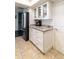 Kitchen area featuring granite countertops, stainless steel fridge, and white cabinets at 7930 E Arlington Rd # 8, Scottsdale, AZ 85250