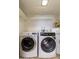 Laundry room with tile floors, a GE water heater and two newer washers and dryers at 7930 E Arlington Rd # 8, Scottsdale, AZ 85250