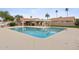 Community pool with clear water, surrounding concrete area, and nearby cabana/bath house at 7931 W Shaw Butte Dr, Peoria, AZ 85345