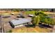 Aerial view showcasing the property's extensive equestrian facilities, including multiple shelters and large, open spaces at 836 W Lenora Way, San Tan Valley, AZ 85140