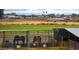 Several horses are shown in their pens, on a sprawling horse property with pasture, pens, and housing at 836 W Lenora Way, San Tan Valley, AZ 85140