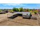 Expansive property featuring a covered patio and fenced yard, ideal for outdoor living and activities at 836 W Lenora Way, San Tan Valley, AZ 85140