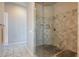 Modern bathroom featuring a tiled shower with glass enclosure and tiled floors at 8504 S 30Th St, Phoenix, AZ 85042
