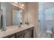 Clean bathroom with a dark vanity, and a subway tile shower with glass doors at 8504 S 30Th St, Phoenix, AZ 85042