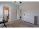 Bedroom featuring a dresser, a desk, and an ensuite bathroom at 8504 S 30Th St, Phoenix, AZ 85042