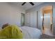 Bedroom featuring closet doors and an ensuite bathroom at 8504 S 30Th St, Phoenix, AZ 85042