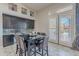 Eat-in kitchen area with a built-in desk, a view of the back, and modern finishes at 8504 S 30Th St, Phoenix, AZ 85042