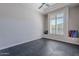Bright room with black floors, natural light from a bright window, and yoga equipment at 8504 S 30Th St, Phoenix, AZ 85042