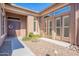 Covered front entryway with double doors, sidelight windows, and well-manicured landscaping at 8504 S 30Th St, Phoenix, AZ 85042