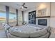 Bright living room with fireplace, custom built-ins, large windows and comfortable seating at 8504 S 30Th St, Phoenix, AZ 85042
